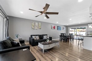 Open-concept, living/ dining area with great tv view.