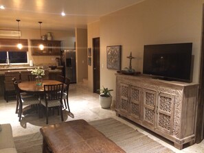 Living Room TV, Dining Table and Kitchen