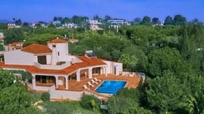 Large garden with cedar, mimosa &palm trees ans blossoming shrubs ensure privacy