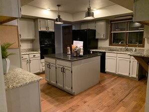 large kitchen ready with all the kitchenware needed to make meals.