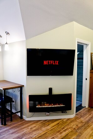 Large TV with Netflix and Amazon Prime.  No local TV or cable.  