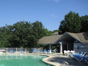 WATERFRONT POOL with covered setting.