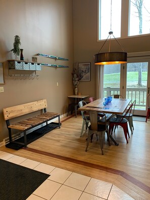 Ample family dining space overlooking golf course. 