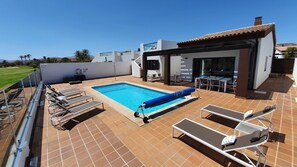 Pool cover protects against dust and cooling overnight 