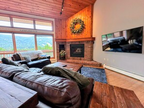 Main Level Living area with TV and gas fireplace