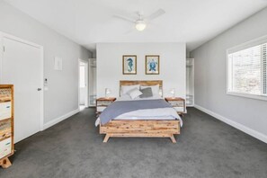 (Upstairs) Master bedroom with queen bed, air conditioning/heating, large en suite (shower & toilet), walk-in-robe, TV and undercover balcony with seating.