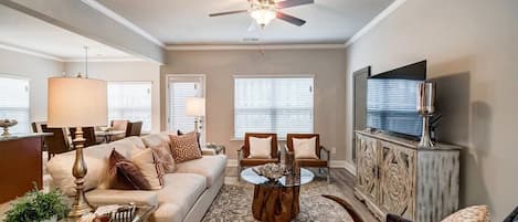 The living room and window with a view directly to the lake & open deck