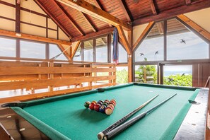 Glazed terrace with beautiful view, hammocks and billiard table. 