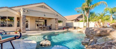 Relax around the built in custom table in the pool