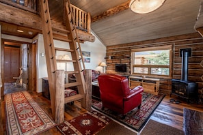 Living room with views, gas fireplace/stove, large Smart TV