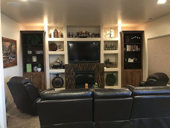 LIVING AREA, WITH LEATHER ELECTRIC RECLINING SOFA AND 2 LEATHER ROCKER RECLINERS