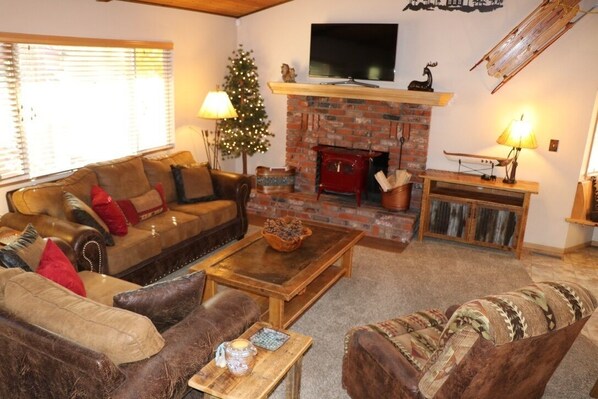 Living room featuring antique fireplace stove