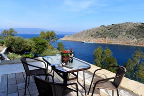 Dining terrace at Arbeli House, overlooking Mandraki bay