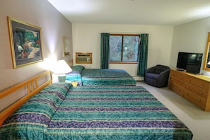 Get a good nights sleep in this bedroom with 2 double beds,43" flat screen TV and A/C.