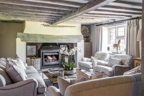 Another view of the sitting room. Two large french linen sofas and arm chairs.