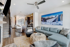 Living Area with Sectional, TV and Exquisite Artwork