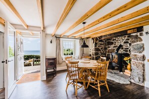 Prospect House, Coverack. Ground floor: Dining room with stunning sea views and inglenook fireplace