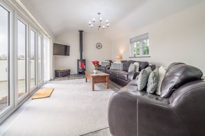 Sunnyside Barn, Truro. Ground floor: Spacious sitting room with wood burning stove