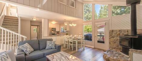 Cozy and clean living room, dining area and kitchen entrance.