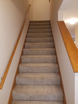 Stairs from main floor to 2 bedrooms on top level.  2 sets of stairs in unit.