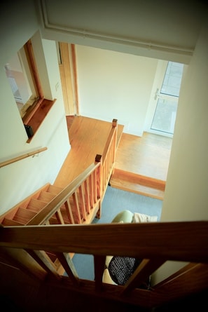 stairs to the upstairs bedroom and en suite wc
