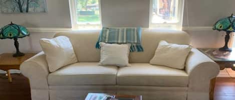 Lovely airy living room with windows on both sides