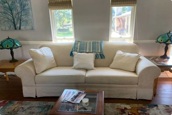 Lovely airy living room with windows on both sides