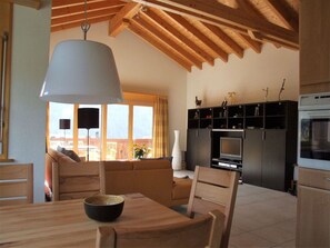 Property, Table, Wood, Couch, Cabinetry, Interior Design, Kitchen Appliance, Countertop, Living Room, Chair