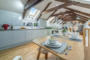 The Shires, St Agnes. First floor: Open plan living area with kitchen, dining area and sitting room