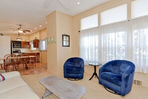 Comfortable seating and large windows with relaxing views outside.