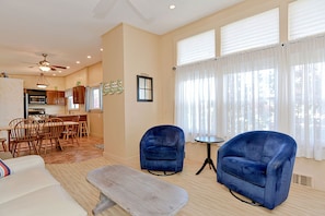 Comfortable seating and large windows with relaxing views outside.