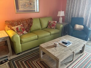 Living Room queen sofa sleeper and chair with sliding glass door to balcony