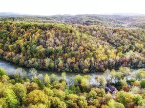 Aerial shot of fall foilage at River`s Edge Lodge