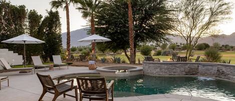 Great patio views - across the pool and golf course to the sunsetting over the mountains