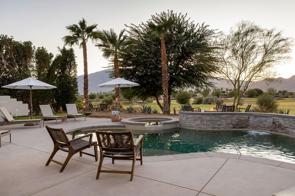 Great patio views - across the pool and golf course to the sunsetting over the mountains