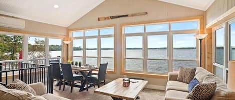 Great room with wrap around windows with outstanding views of the water.