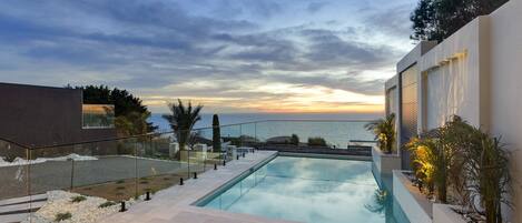 Sunset by the large FULLY gas heated pool - Ocean View from pool