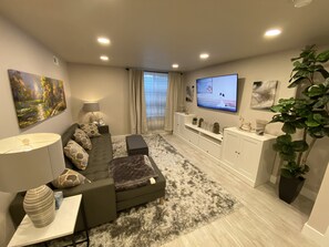 Living Room - Leather Sofa, Large Flat Screen, Blu-Ray Player