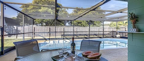 Enjoy a bit of wine and fruit in the shade near your private pool.