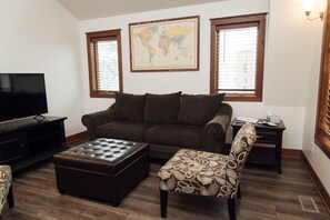 Vaulted ceiling in living room, natural lighting, card and board games for fun.