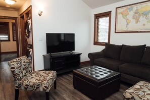 Vaulted ceiling in living room, natural lighting, card and board games for fun.