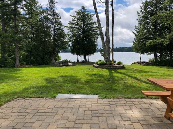 Patio view of the lake and fire pit 