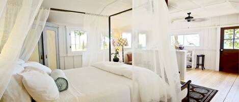 Inside view of James Cottage, warm, soft lighting and egyptian cotton sheets.