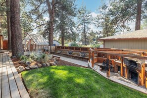 back yard view from deck with pizza oven