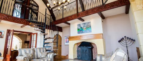 double height sitting room with log burner