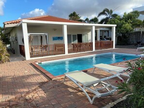 Large swimming pool and porch with security fence for children 