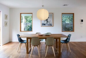 Gather around—spacious wooden dining table with seating for six.