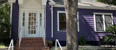 Adorable purple bungalow right on W. 6th Street!