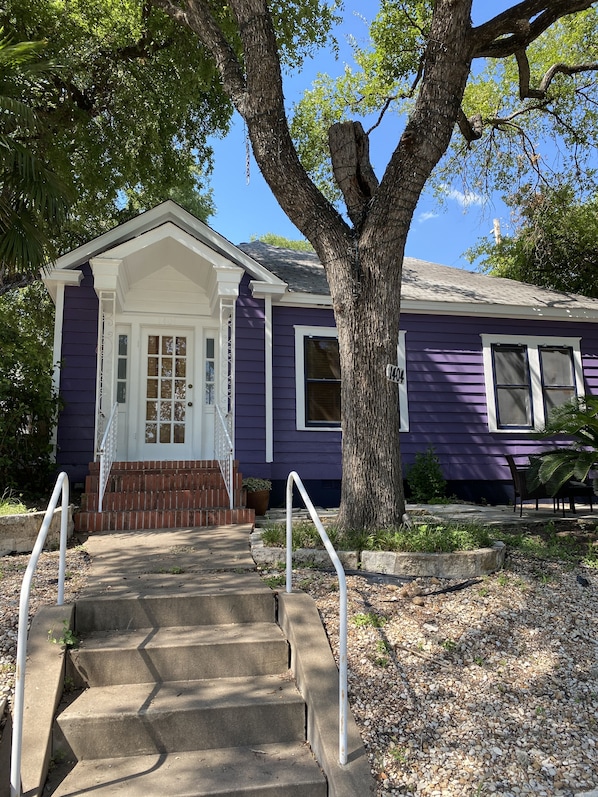 Adorable purple bungalow right on W. 6th Street!