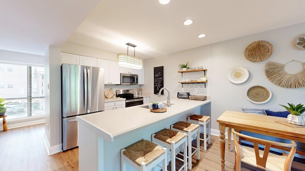 Fully Stocked Kitchen with Countertop Seating
